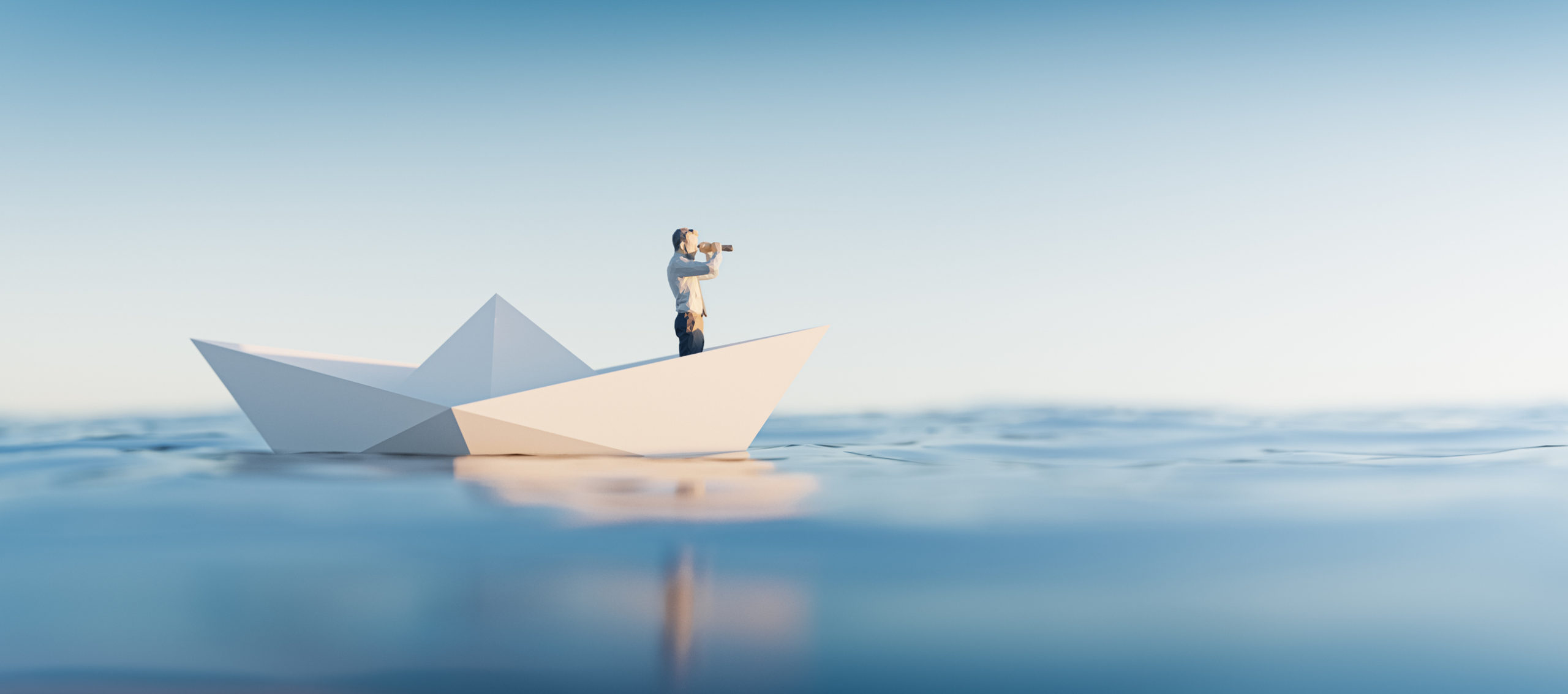 Man floating on a paper boat looking towards the horizon
