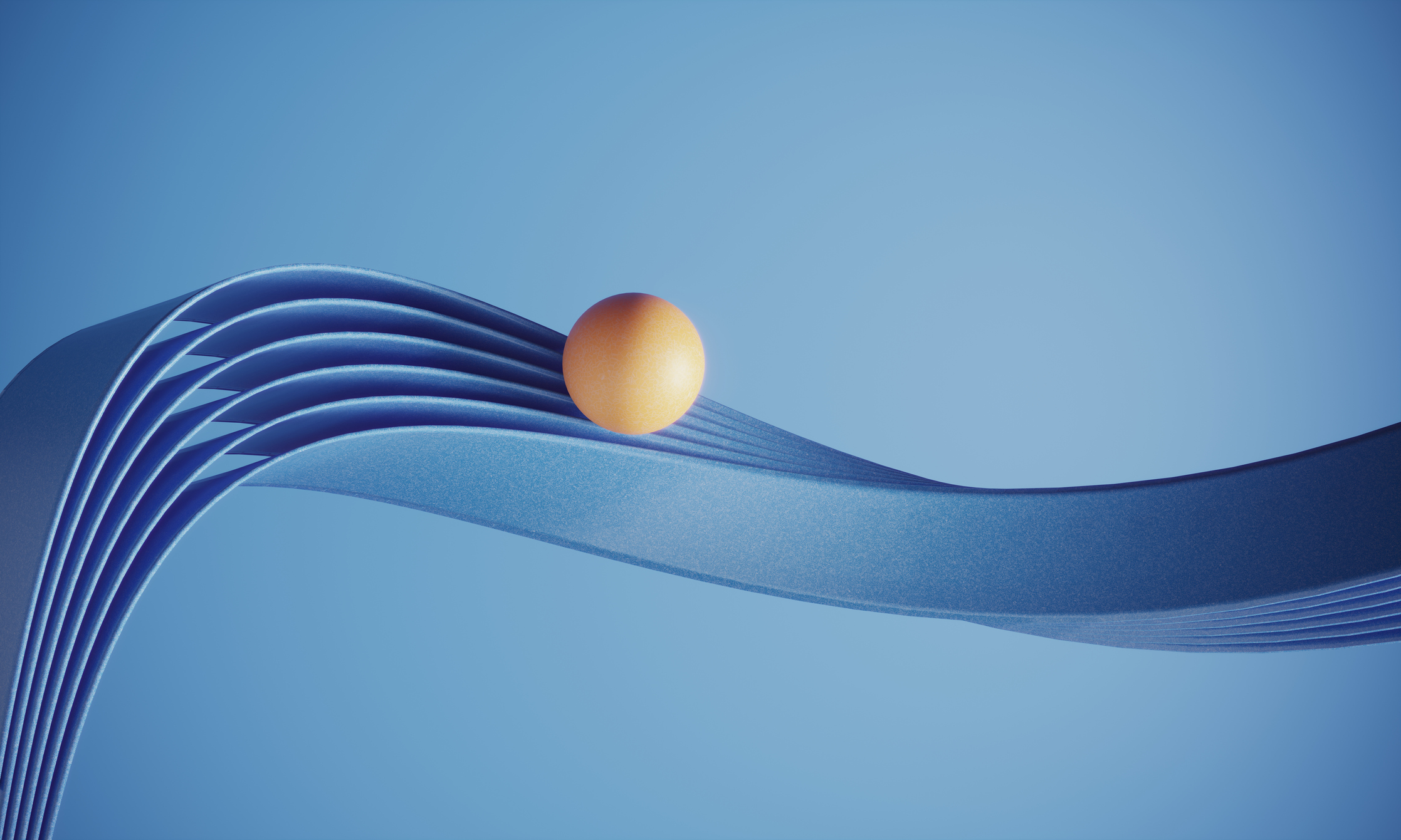 Image of orange ball on a twisty blue track