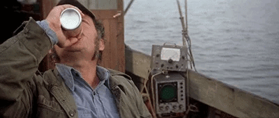 Gif of the fisherman from Jaws drinking a beer