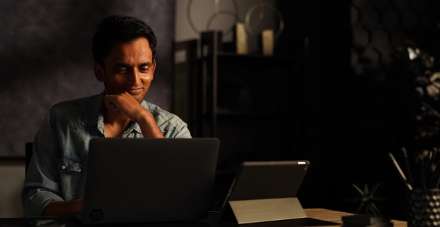 Male Basis employee working at his computer