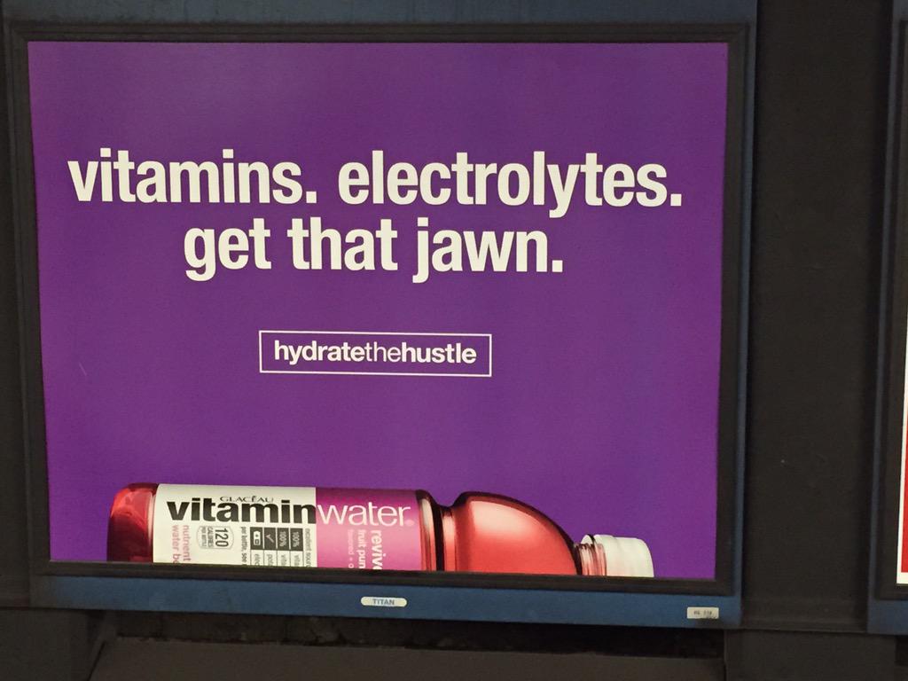 Billboard for Vitamin Water that reads "vitamins. electrolytes. get that jawn."