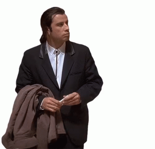 A GIF of John Travolta from the movie "Pulp Fiction" looking around trying to find something.