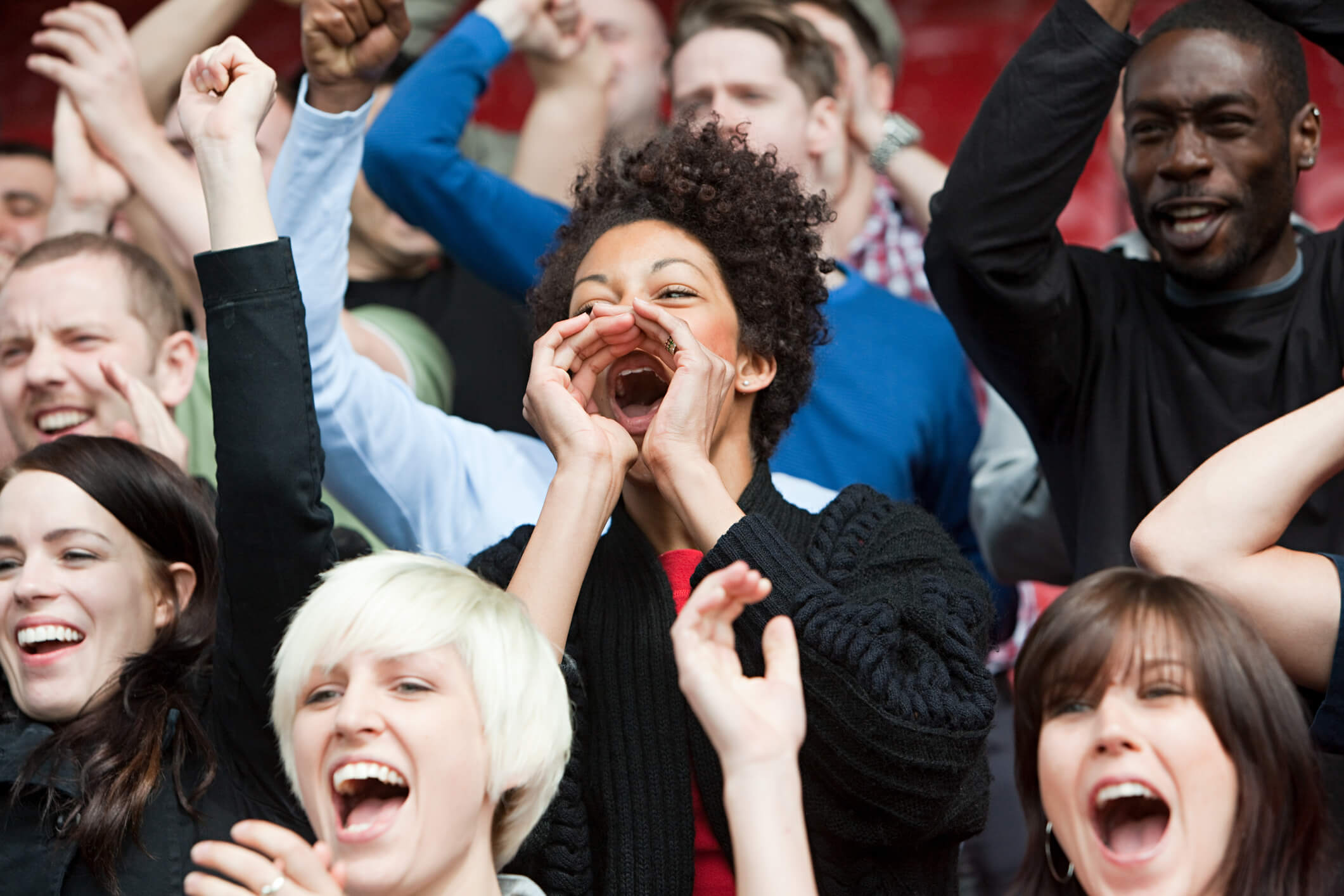 A crowd applauding and cheering.