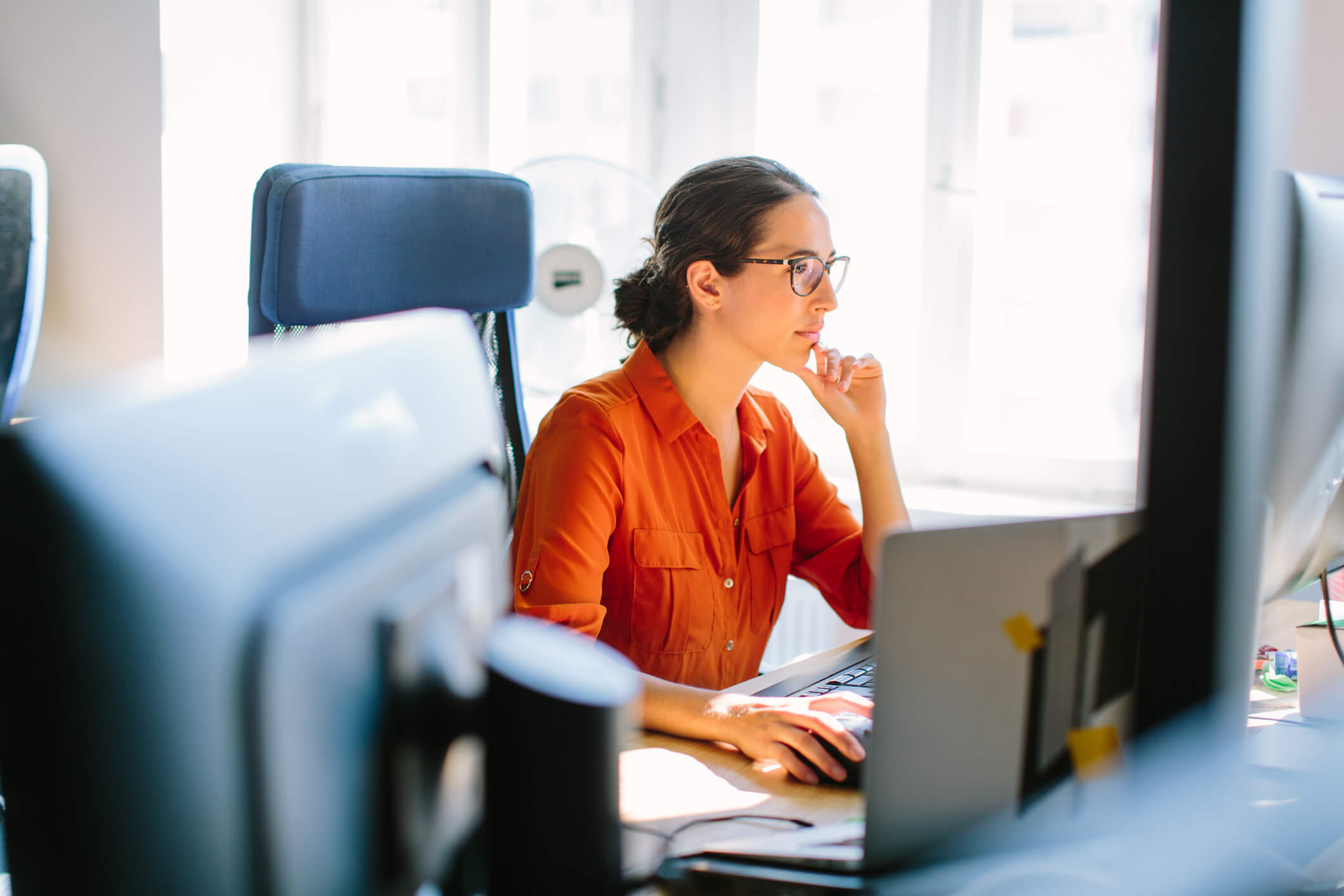 Marketer working at her computer