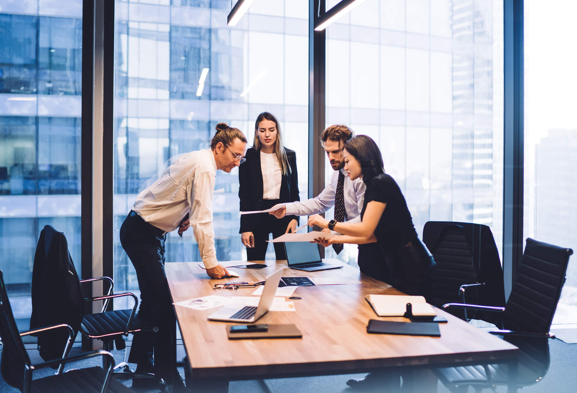 Marketers working together in the office at a conference table