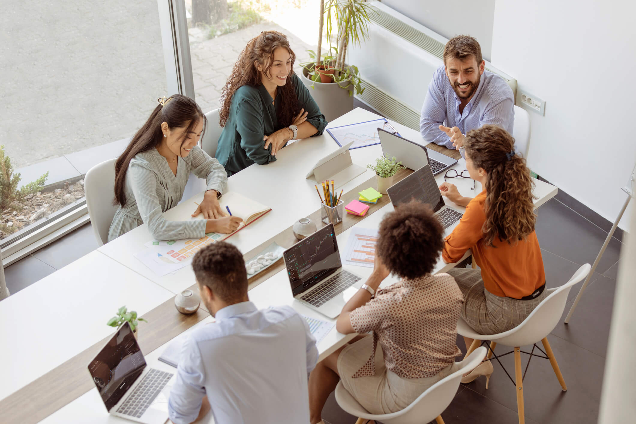 An image of a group of advertising professionals sitting around a table