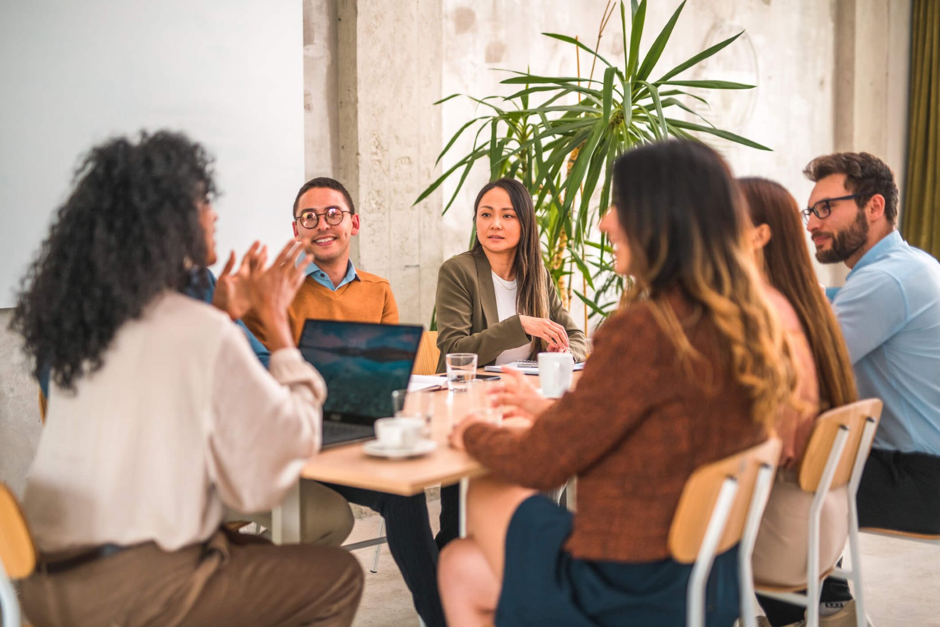 An image showing advertising professionals sitting around a table in an office