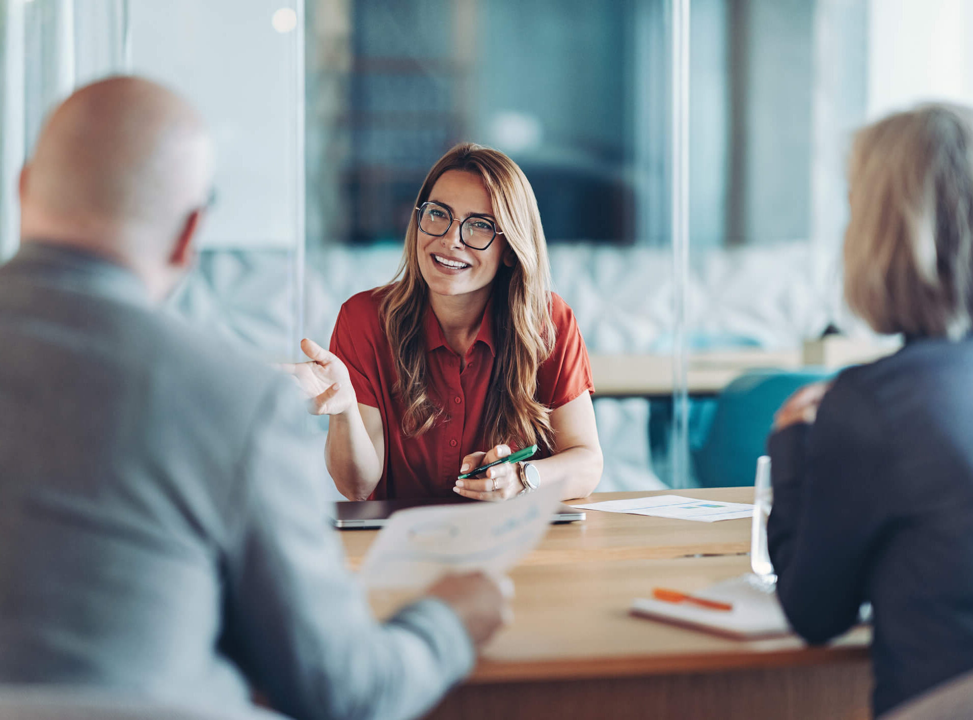 Marketing leader talking with peers in the office