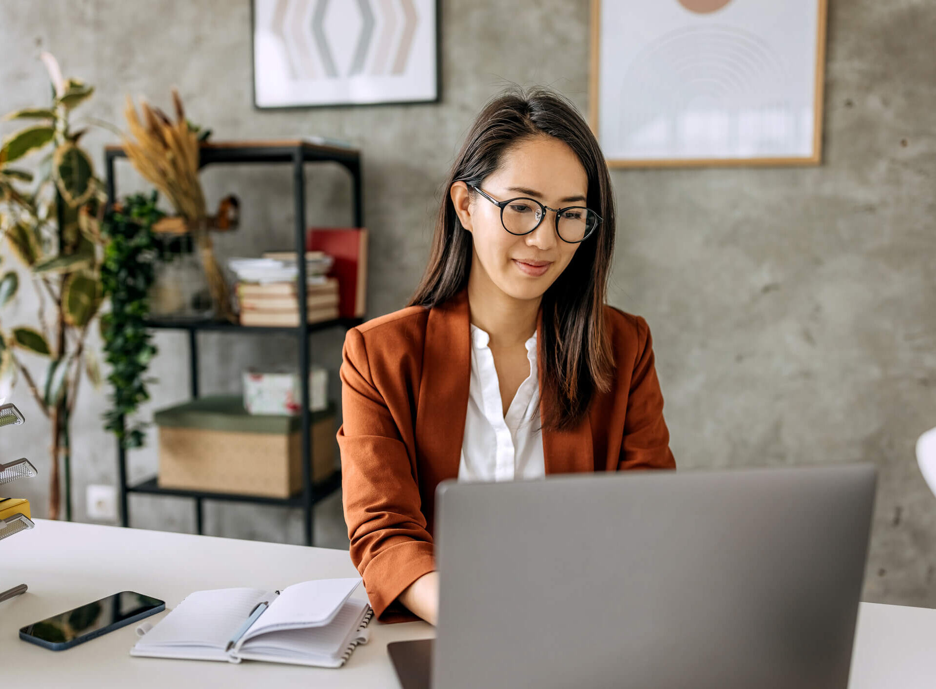 Marketer working at her computer