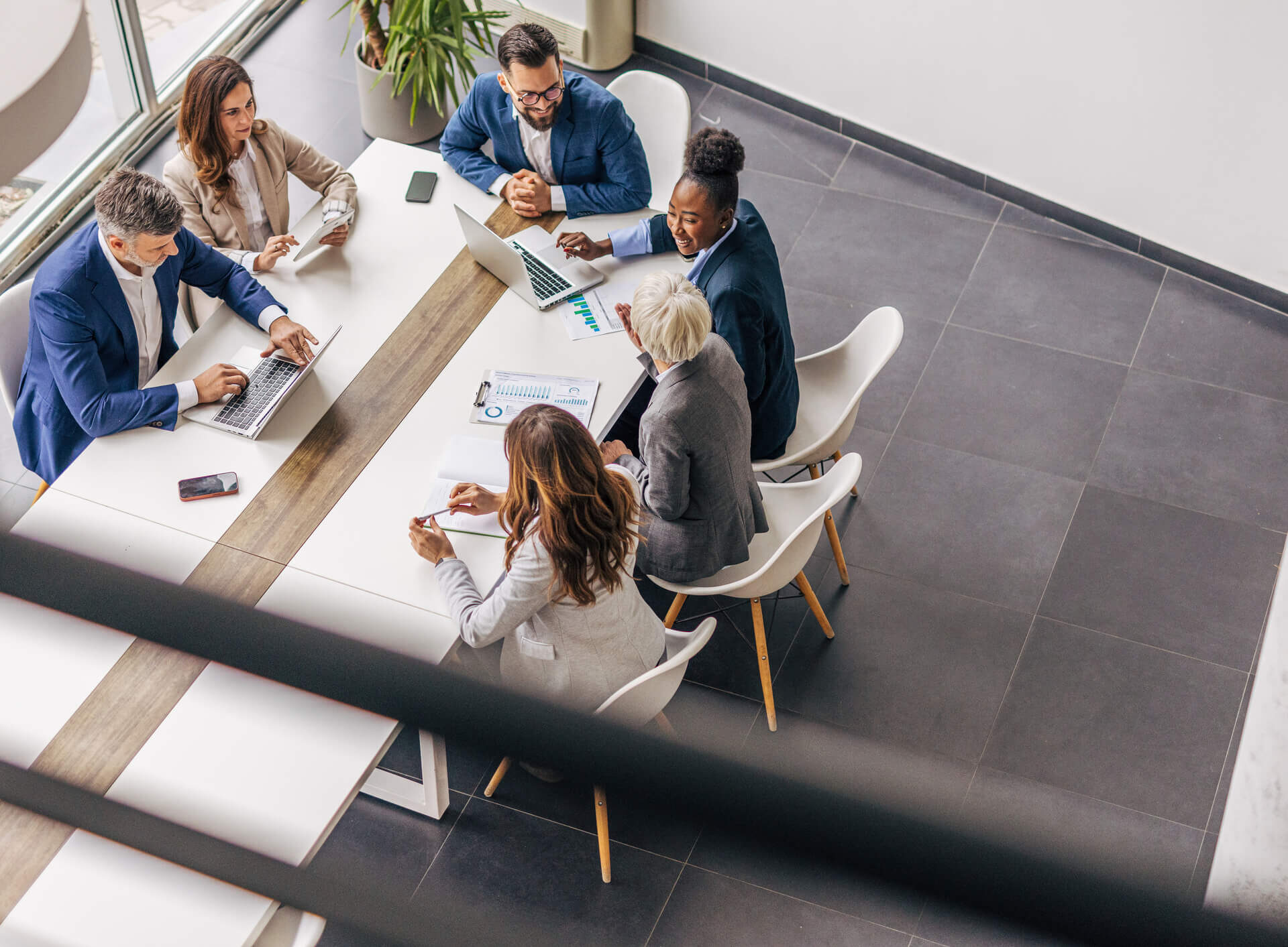 Business leaders meeting at a table in a conference room