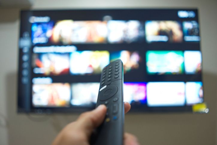 An image of a connected tv and a remote control