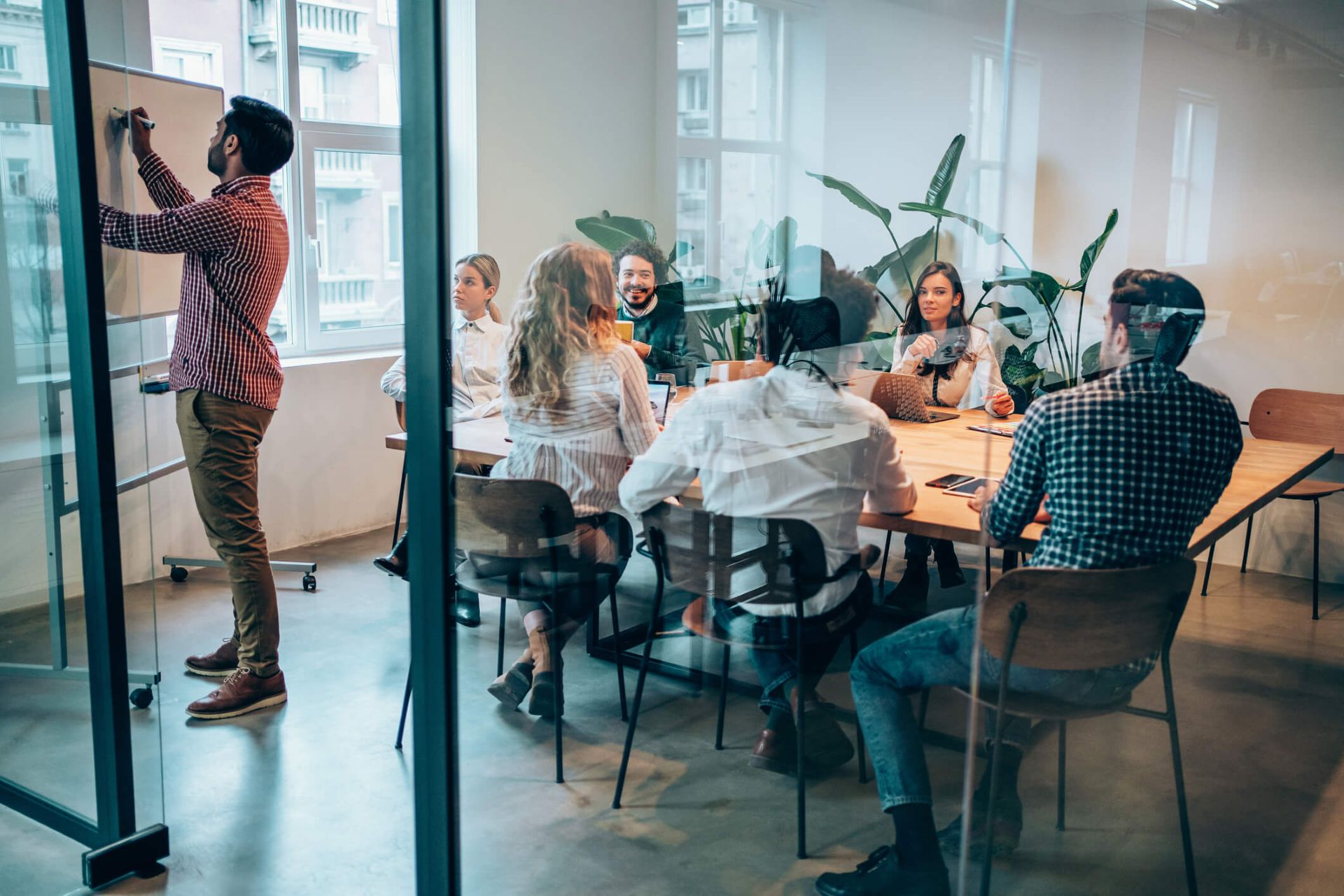 An image of a paid media team planning a brand launch